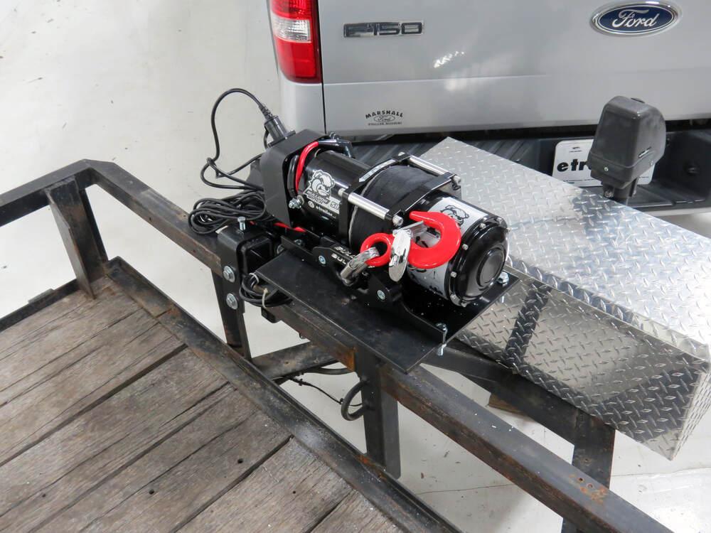 12 volt electric trailer winch installed on a car hauler for loading vehicles