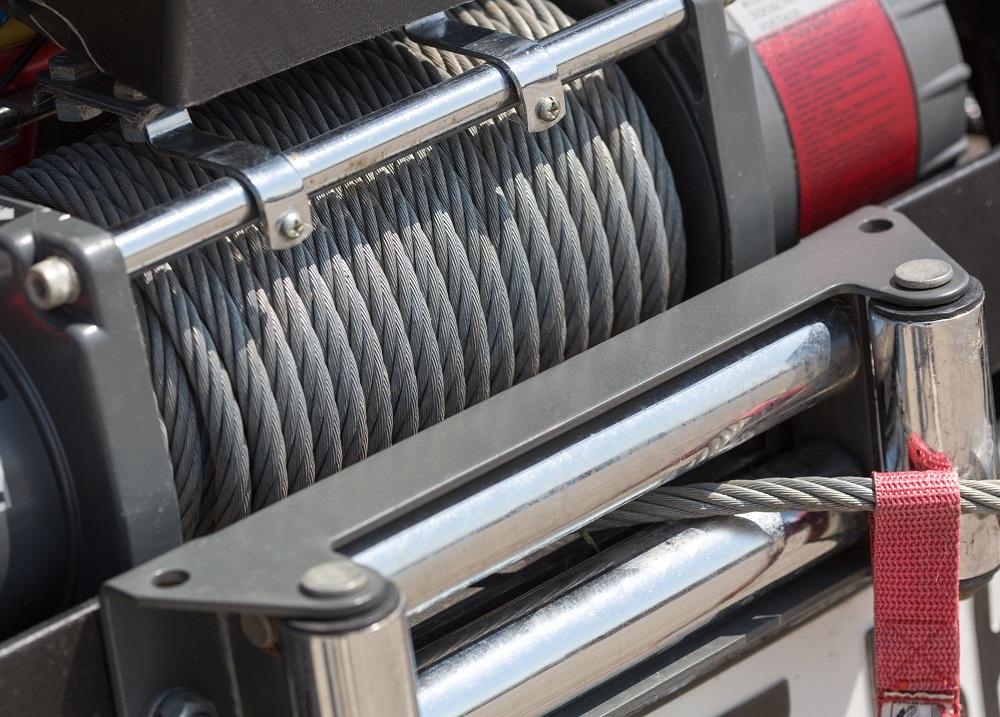 Trailer winch drum holding cable for pulling heavy loads